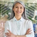 happy-confident-senior-asian-businesswoman-standin-QWQTFSQ.jpg